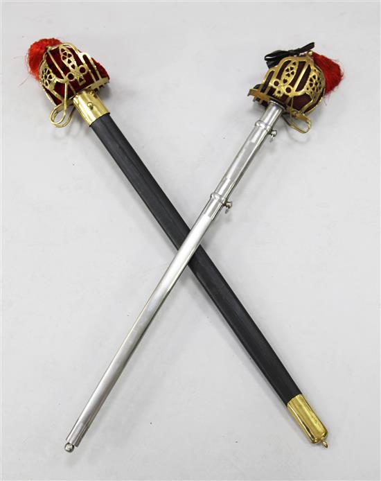 Two 18th century style swords and scabbards,